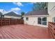 The backyard includes a large deck with painted railings for outdoor enjoyment at 6177 Idlewood Cir, Lithonia, GA 30038