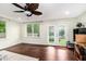 Bright and airy bedroom with hardwood floors and access to the backyard at 6177 Idlewood Cir, Lithonia, GA 30038