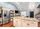 Modern kitchen with a granite island, stainless steel refrigerator, and ample cabinet space at 6177 Idlewood Cir, Lithonia, GA 30038