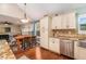Charming kitchen featuring granite countertops, stainless steel appliances, and ample storage at 6177 Idlewood Cir, Lithonia, GA 30038