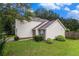 Well-maintained two-story home with a lush green lawn and mature landscaping at 6177 Idlewood Cir, Lithonia, GA 30038