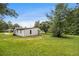 Spacious backyard with large trees and ample green space for outdoor enjoyment at 1186 Eastview Ne Rd, Conyers, GA 30012
