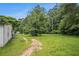 Lush backyard with mature trees, perfect for outdoor activities and relaxation at 1186 Eastview Ne Rd, Conyers, GA 30012