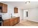 Spacious kitchen featuring wood cabinets, stainless steel appliances, and stylish backsplash at 1186 Eastview Ne Rd, Conyers, GA 30012