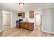 Kitchen with wood cabinets, stainless steel appliances, and a spacious layout at 1186 Eastview Ne Rd, Conyers, GA 30012