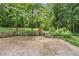 Spacious backyard featuring a stone fireplace at 2839 Orion Dr, Decatur, GA 30033