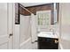 Charming bathroom showcasing a shower-tub combo and decorative wallpaper at 2839 Orion Dr, Decatur, GA 30033