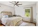 Cozy bedroom features a ceiling fan, natural light, and neutral tones creating a tranquil atmosphere at 2839 Orion Dr, Decatur, GA 30033