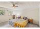 Comfortable bedroom with two windows that offer natural lighting and a ceiling fan at 2839 Orion Dr, Decatur, GA 30033