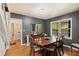 Dining room featuring hardwood floors, elegant furniture and a view of the front yard at 2839 Orion Dr, Decatur, GA 30033