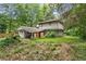 Backyard view of a two-story home surrounded by greenery at 2839 Orion Dr, Decatur, GA 30033