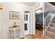 Hallway featuring access to a bathroom, a dining area, and the carpeted stairs at 2839 Orion Dr, Decatur, GA 30033