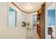 Hallway with carpet and a built in shelf. Bedrooms and bathrooms off of this hallway at 2839 Orion Dr, Decatur, GA 30033