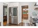 Bright kitchen featuring stainless steel refrigerator and dark hardwood floors at 2839 Orion Dr, Decatur, GA 30033