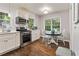 Well-lit kitchen showcasing stainless steel appliances and eat-in dining space at 2839 Orion Dr, Decatur, GA 30033