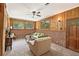 Cozy living room with paneled walls, brick accents, and bright natural light at 2839 Orion Dr, Decatur, GA 30033
