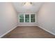 Bright, spacious bedroom with hardwood floors and three windows providing natural light at 2894 Regent Walk Dr, Duluth, GA 30096