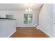Open dining area features hardwood floors, neutral paint and a view of the staircase at 2894 Regent Walk Dr, Duluth, GA 30096