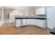 Well-lit kitchen with white cabinets, stainless steel appliances, and granite countertops at 2894 Regent Walk Dr, Duluth, GA 30096