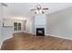 Inviting living area with hardwood floors, cozy fireplace, and ample natural light at 2894 Regent Walk Dr, Duluth, GA 30096