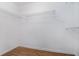 Walk-in closet with wood-style flooring and wire shelving for efficient storage at 2894 Regent Walk Dr, Duluth, GA 30096