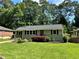Beautiful one-story home with lush green lawn, tidy landscaping, and inviting curb appeal at 2985 Westbury Dr, Decatur, GA 30033