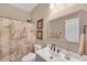 Well-lit bathroom with a marble design shower curtain and a neutral color scheme at 3262 Beech Hollow Ct, Loganville, GA 30052