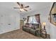 Cozy bedroom featuring a ceiling fan and neutral colors at 3262 Beech Hollow Ct, Loganville, GA 30052