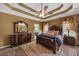 Main bedroom showcasing a tray ceiling, and carpeted floors at 3262 Beech Hollow Ct, Loganville, GA 30052
