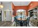 Dining room with a round wooden table and wainscoting at 3262 Beech Hollow Ct, Loganville, GA 30052