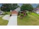 Well-maintained home with a landscaped front yard and driveway at 3262 Beech Hollow Ct, Loganville, GA 30052