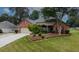 Aerial view of the house featuring a well maintained front yard and 2 car garage at 3262 Beech Hollow Ct, Loganville, GA 30052