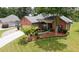 Beautiful single-story home with a manicured lawn, stone-lined garden, and charming curb appeal at 3262 Beech Hollow Ct, Loganville, GA 30052
