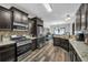 Spacious kitchen with stainless steel appliances and stone countertops at 3262 Beech Hollow Ct, Loganville, GA 30052