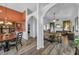 Open concept living and dining area with wood floors at 3262 Beech Hollow Ct, Loganville, GA 30052