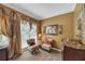 Cozy sitting room with a window view, neutral decor, and plush armchairs at 3262 Beech Hollow Ct, Loganville, GA 30052