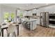 Bright eat-in kitchen featuring stainless steel appliances and a center island with seating at 3715 Near Star Ln, Cumming, GA 30028