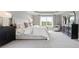 Serene main bedroom with a large window, comfortable bed, and elegant furniture at 3715 Near Star Ln, Cumming, GA 30028