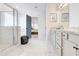 Bright, modern bathroom featuring white marble flooring and a glass-enclosed shower at 4824 Sultana Sw Way, Atlanta, GA 30331