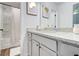 Clean bathroom features shower and tub combo with a decorative vanity at 4824 Sultana Sw Way, Atlanta, GA 30331
