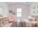 Bedroom with -like decor, chair, and bed frame at 4824 Sultana Sw Way, Atlanta, GA 30331
