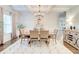 Elegant dining room with coffered ceilings, modern chandelier, and neutral decor at 4824 Sultana Sw Way, Atlanta, GA 30331