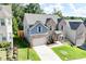 Well-maintained brick and blue home with attached garage, lovely landscaping, and green lawn at 4824 Sultana Sw Way, Atlanta, GA 30331