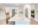 Bright, open kitchen features a large island with granite countertops and bar stool seating at 4824 Sultana Sw Way, Atlanta, GA 30331