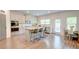 Modern kitchen features white cabinets, stainless steel appliances, a central island, and bar stool seating at 4824 Sultana Sw Way, Atlanta, GA 30331