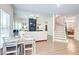 Open-concept living room with dining area and lots of natural light and open staircase at 4824 Sultana Sw Way, Atlanta, GA 30331