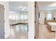 Open-concept living room showcases hardwood floors and a large sectional couch, blending comfort and style at 4824 Sultana Sw Way, Atlanta, GA 30331