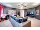 Spacious home theatre room with projector, theater decor, a ceiling fan, and comfortable seating at 4824 Sultana Sw Way, Atlanta, GA 30331