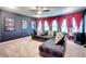 Home theatre area featuring projector, theater decor, a ceiling fan, and comfortable seating at 4824 Sultana Sw Way, Atlanta, GA 30331