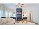 Cozy living room featuring a fireplace, television, stylish decor, and comfortable sectional seating at 4824 Sultana Sw Way, Atlanta, GA 30331
